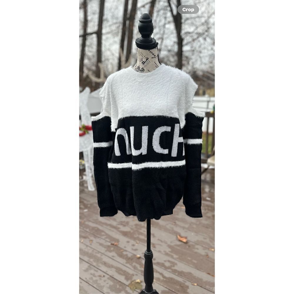 Oversized, cold shoulder, black and white fuzzy sweater.